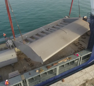Components on dry-dock in crane transport before deployment