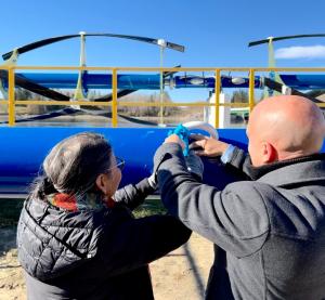 Native Elder Geraldine Shingoose and ORPC Canada's Alexandre Paris during Water Ceremony prior to RivGen® device deployment, Manitoba, Canada. CREDIT ORPC